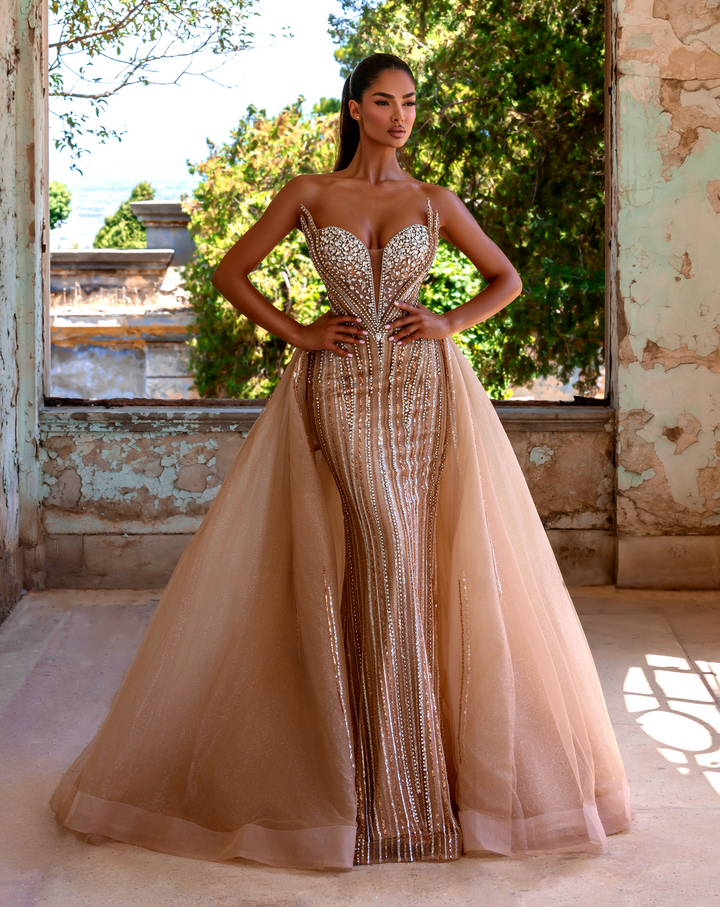 Delilah LD21132 Plunging Crystal Cup Corset Sheath Gown with Full Overskirt - Champagne front view