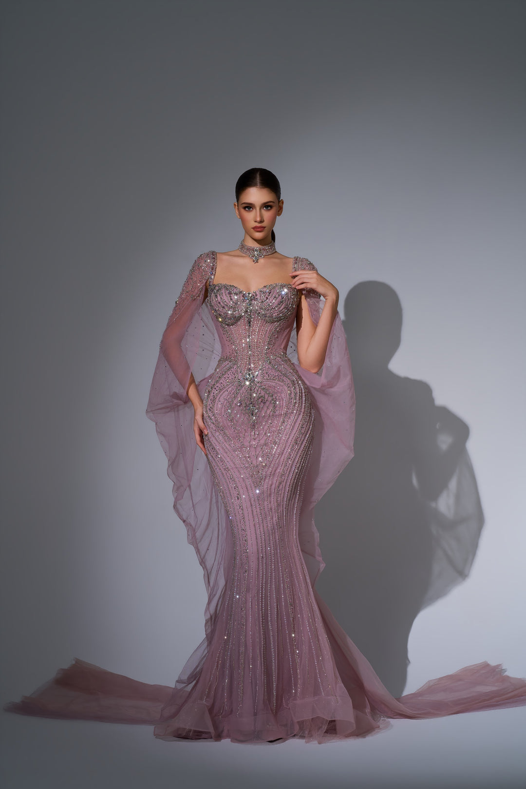 Delilah LD12076 Crystal Corset Mermaid Gown with Choker and Floor-Length Cape Sleeves - Pink front view