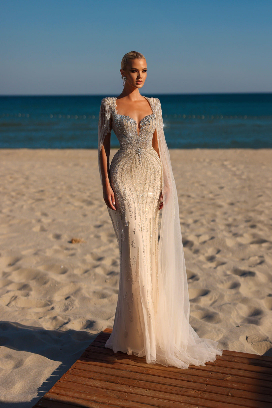 Delilah HM329 Plunging Sweetheart Beaded Mermaid Gown with Crystal Fringe Straps and Cape Sleeves - White full view