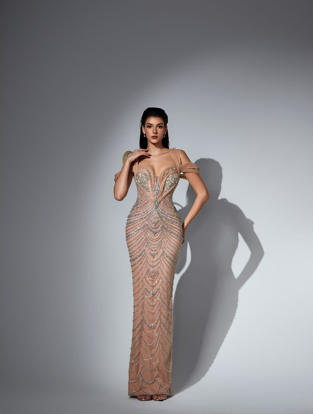 Delilah LD11579 Plunging Beaded Swag Fringe Column Gown with Pleated Off-Shoulder Straps - Champagne front view