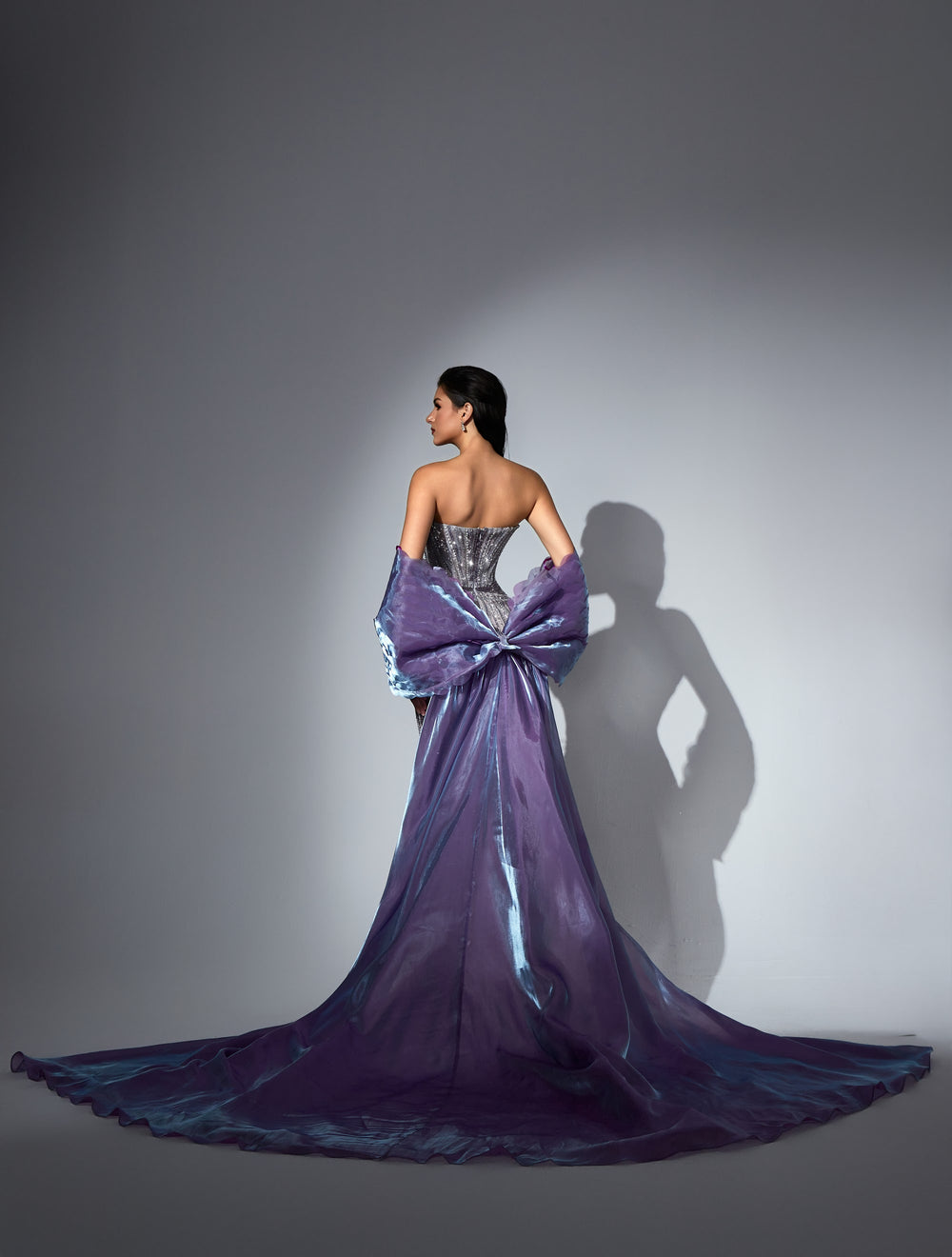 Delilah LD11573 Strapless Crystal Corset Mermaid Gown with Bow Overskirt Train - Purple back view