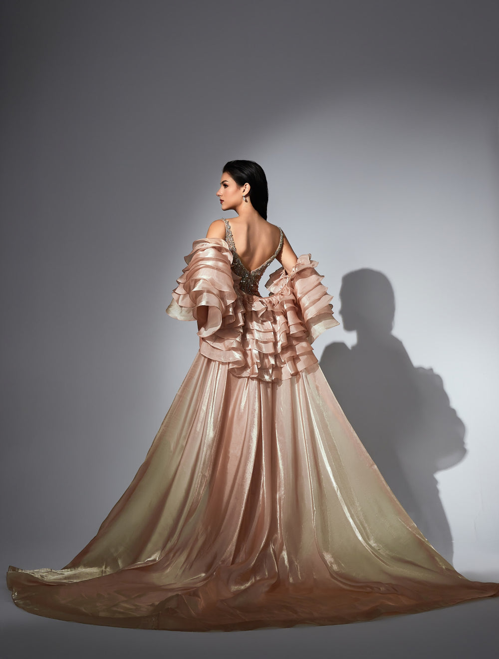 Delilah LD11585 Spaghetti Strap Crystal Corset Mermaid Gown with Ruffle Sleeves and Overskirt - Champagne back view