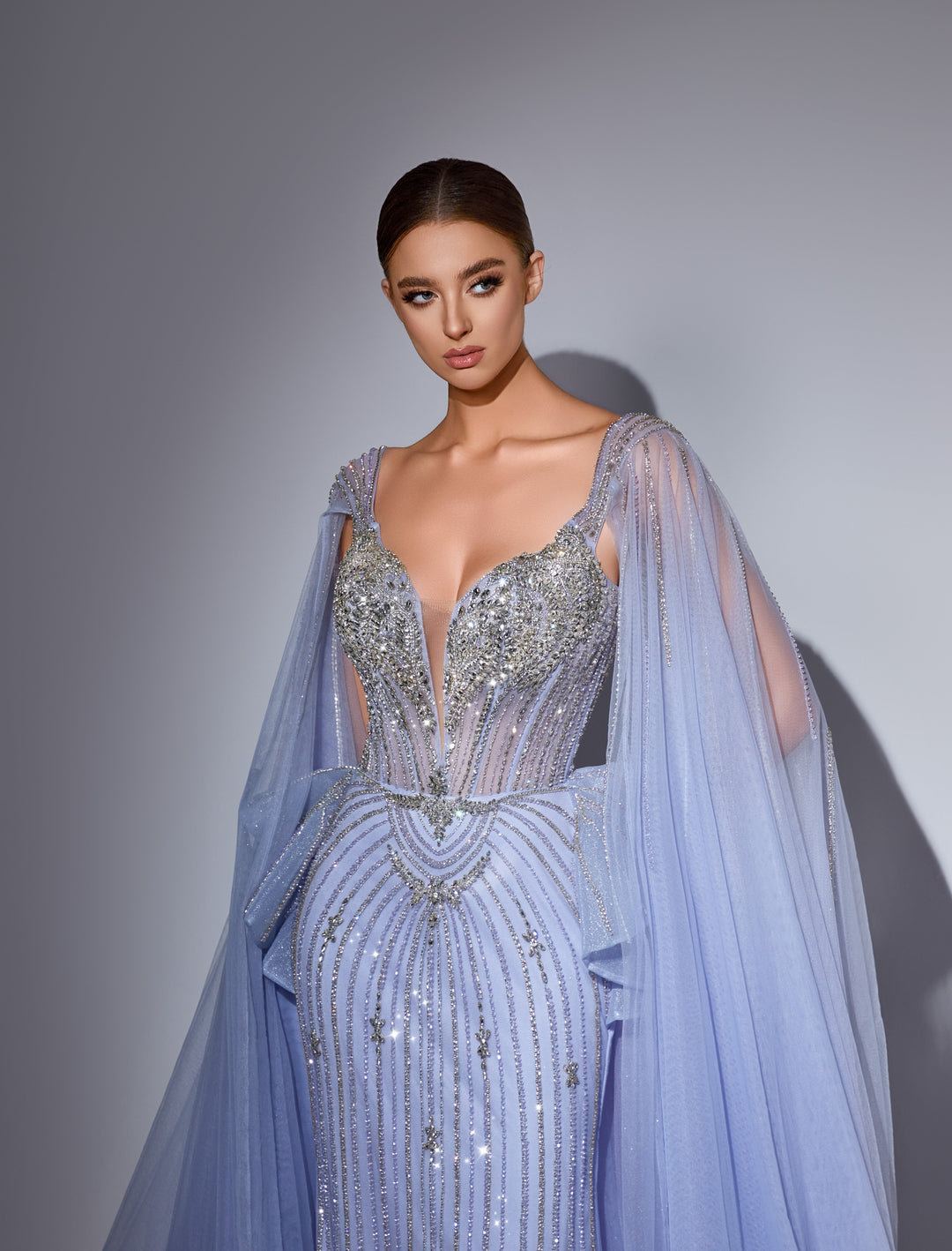 Delilah LD11214 Plunging Sweetheart Beaded Corset Mermaid Gown with Cape Sleeves and Overskirt - Blue close-up view