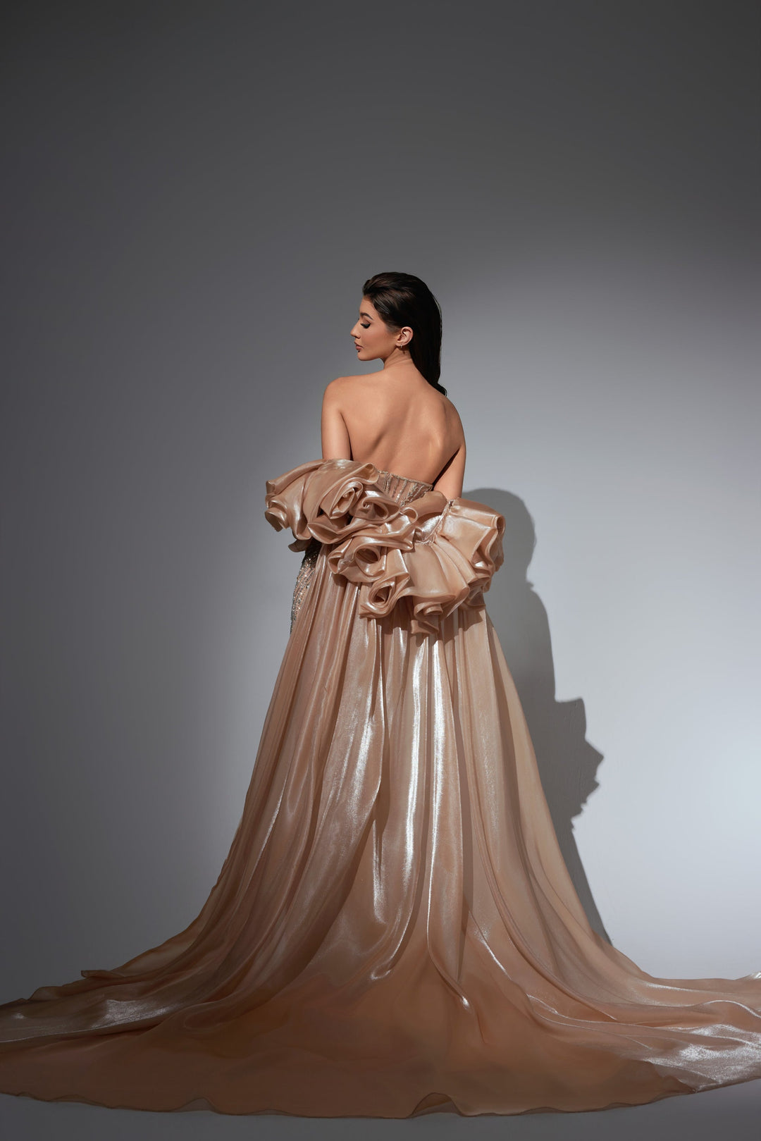 Delilah LD11441 Strapless Beaded Corset Mermaid Gown with Rosette Overskirt Train - Champagne back view