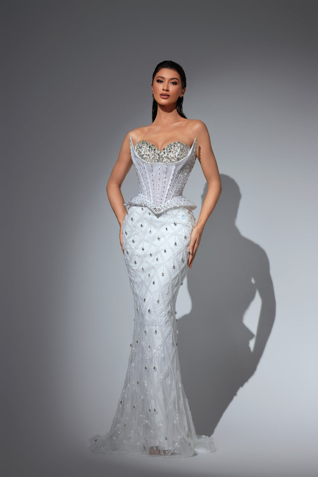 Delilah LD23012 Strapless Crystal Cup Corset Sheath Gown with Peplum and Teardrop Crystals - White front view