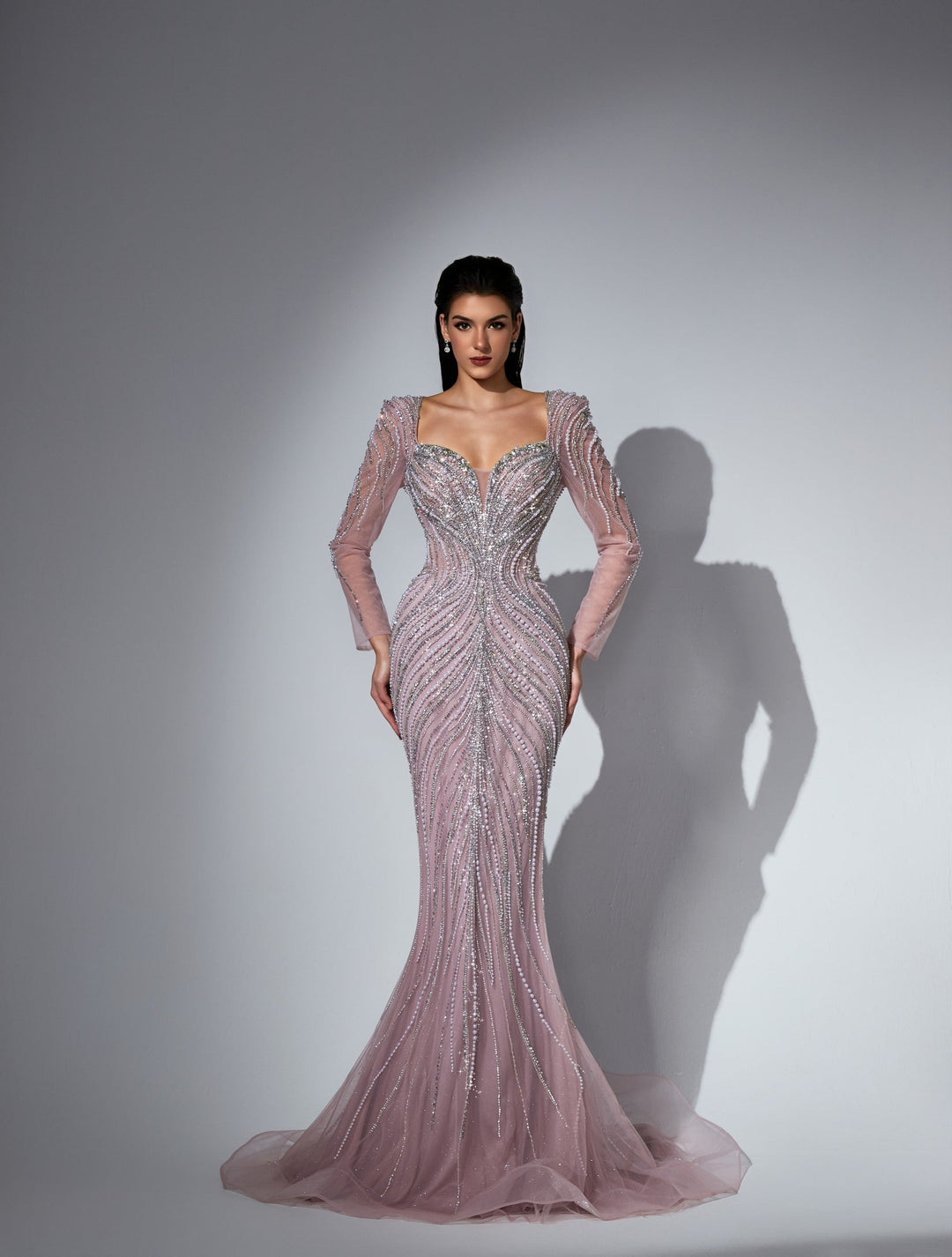 Delilah LD11475 Plunging Illusion Long Sleeve Beaded Corset Sheath Gown with Overskirt - Pink front view