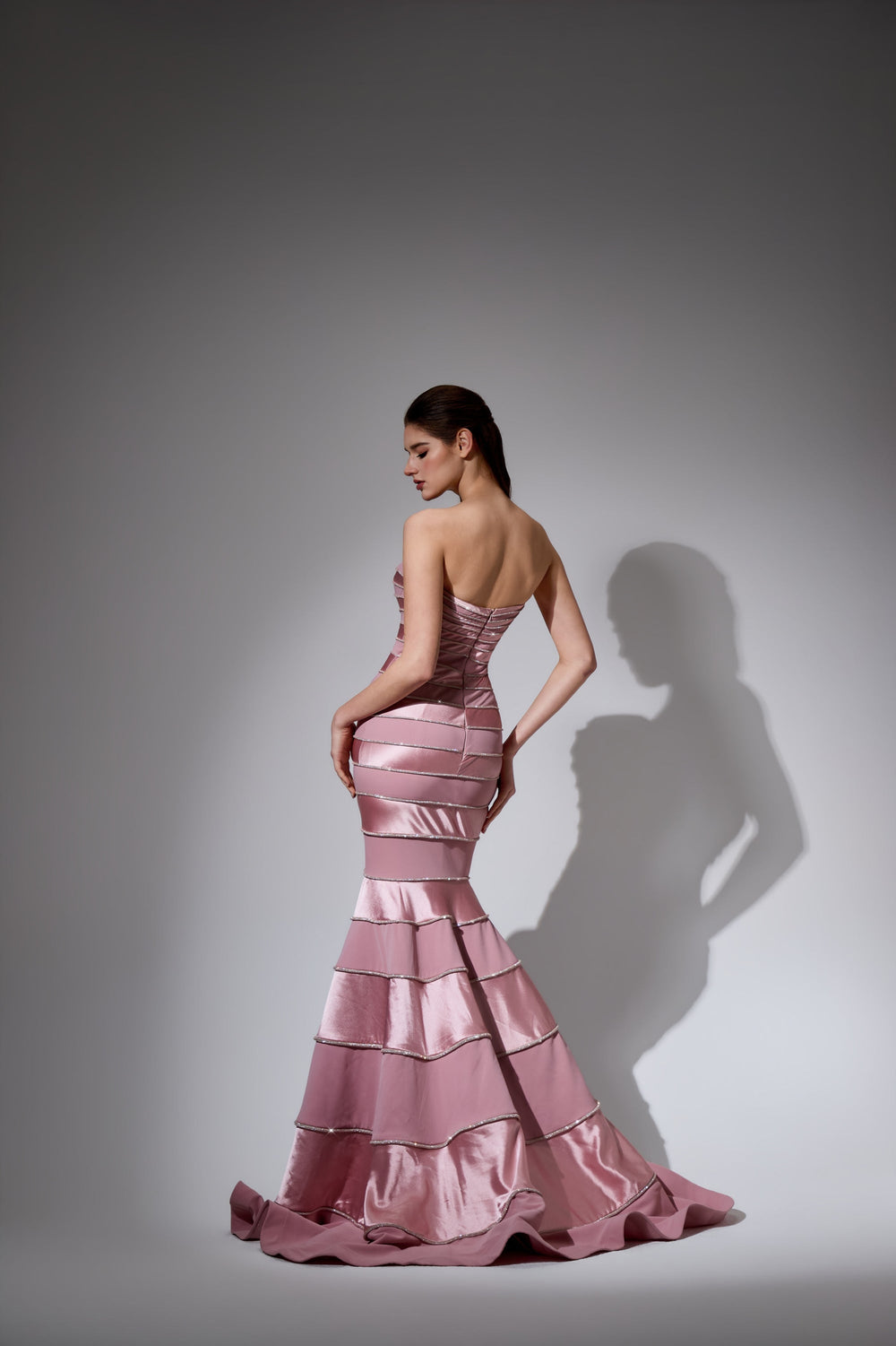 Delilah LD41056 Strapless Banded Mermaid Gown with Beaded Seams and Layered Hem - Pink back view