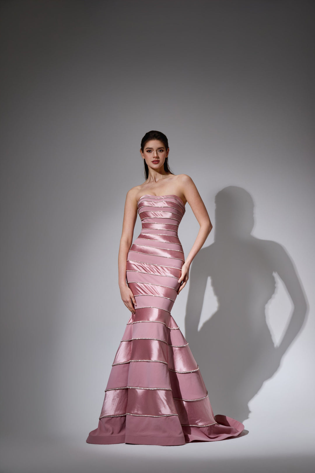 Delilah LD41056 Strapless Banded Mermaid Gown with Beaded Seams and Layered Hem - Pink front view