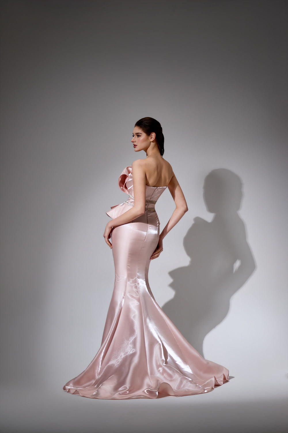 Delilah LD41044 Strapless Pleated Mermaid Gown with Ruffled Peplum and Crystal Waist - Pink back view