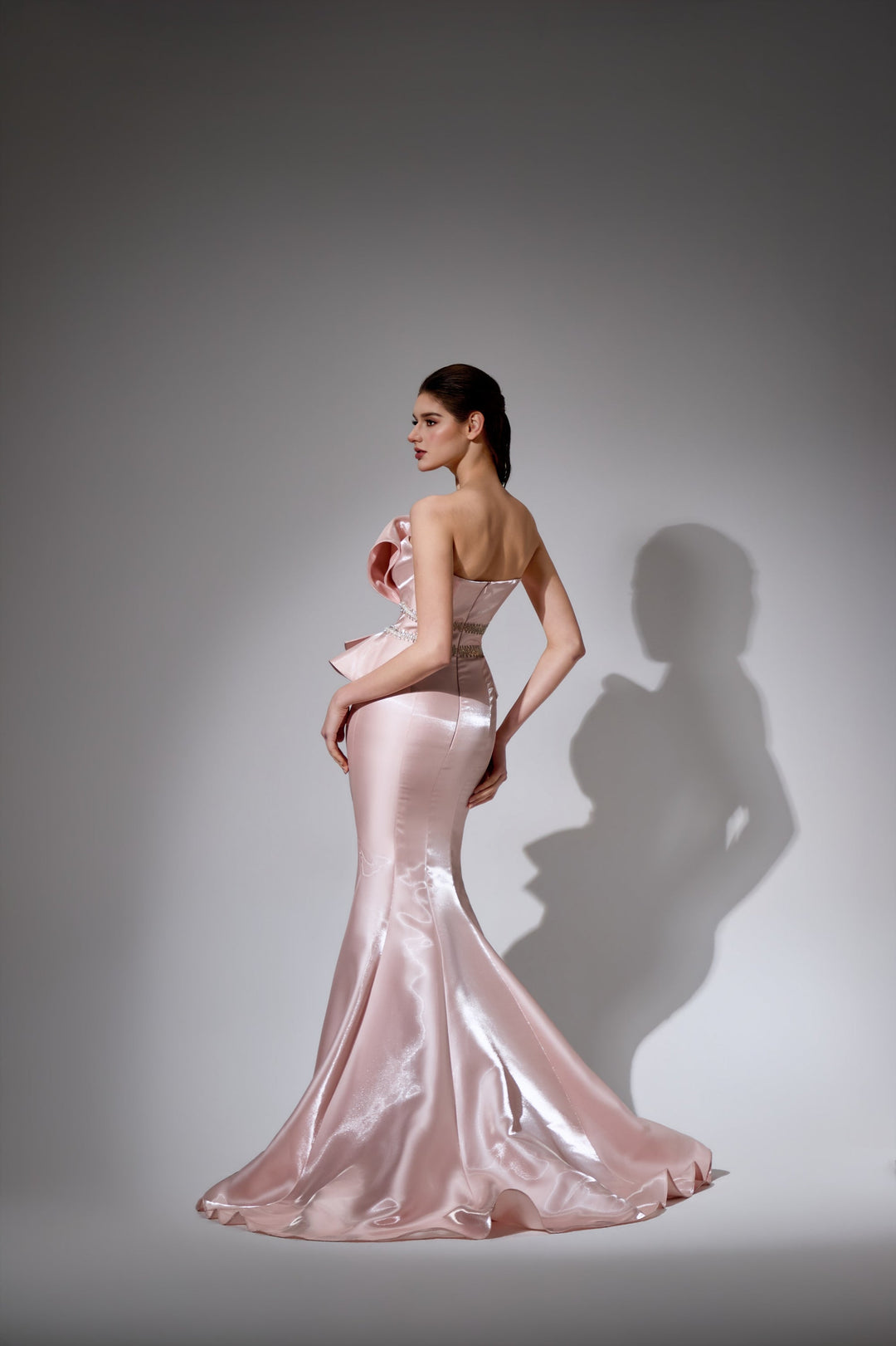 Delilah LD41044 Strapless Pleated Mermaid Gown with Ruffled Peplum and Crystal Waist - Pink back view
