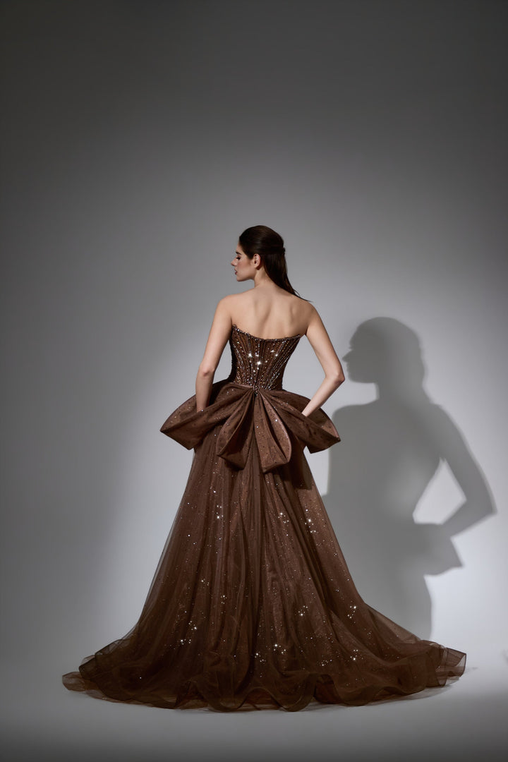 Delilah LD12047 Strapless Sweetheart Beaded Corset Sheath Gown with Bow Overskirt - Brown back view
