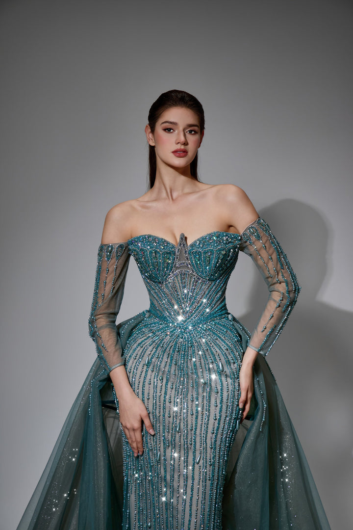 Delilah LD11539 Off-the-Shoulder Long Sleeve Beaded Corset Sheath Gown with Sparkle Overskirt - Green close-up view