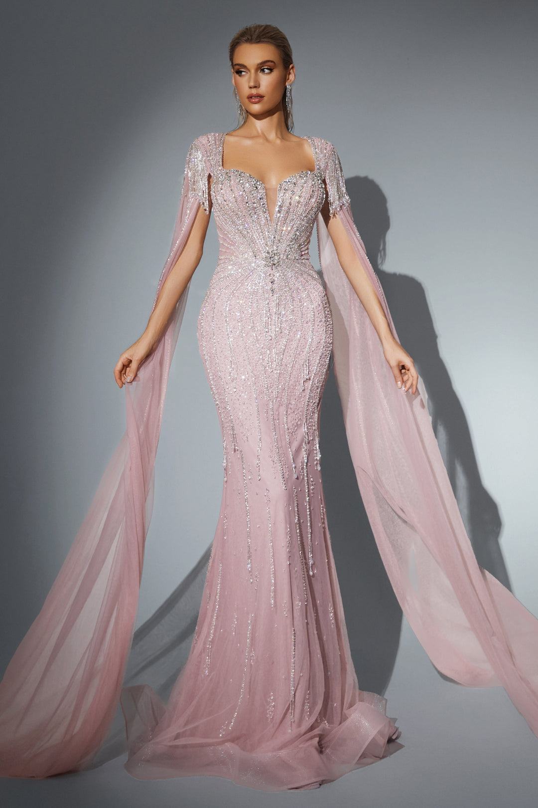 Delilah HM329 Plunging Sweetheart Beaded Mermaid Gown with Crystal Fringe Straps and Cape Sleeves - Pink front view