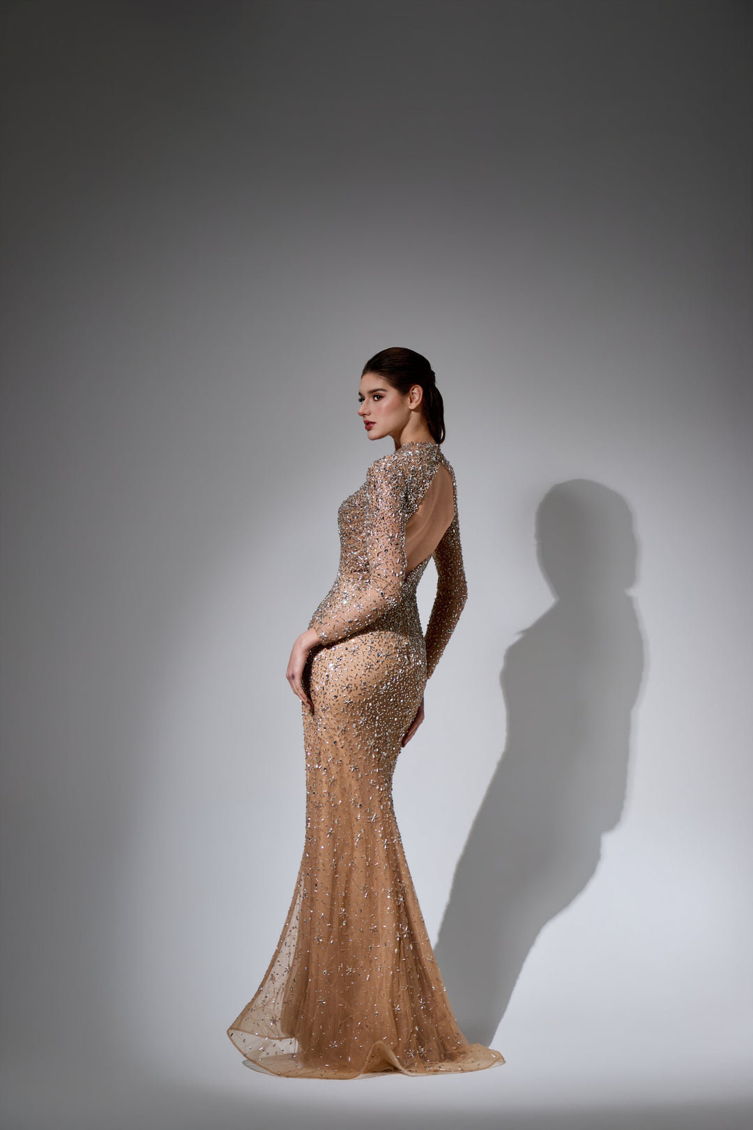 Delilah LD21193 Long Sleeve High Neck Sequin Sheath Gown with Cut-Out and Slit - Champagne back view