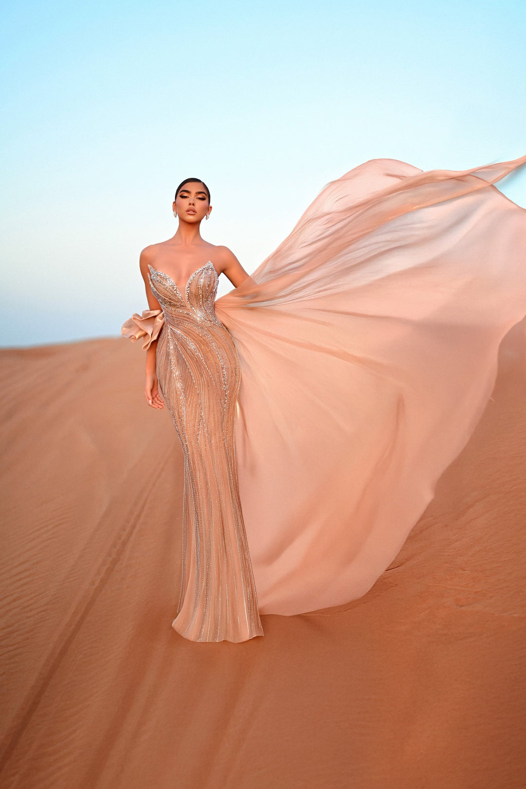 Delilah HM402 Strapless Plunging Sweetheart Beaded Mermaid Gown with Ruffled Overskirt - Champagne front view