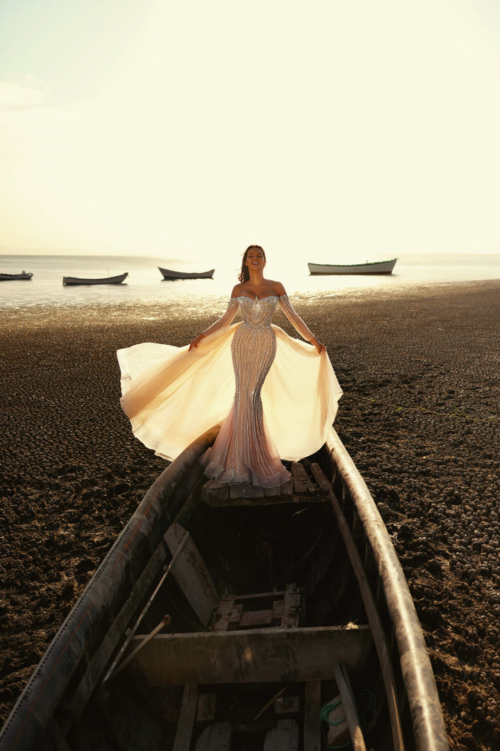 Delilah LD11539 Off-the-Shoulder Long Sleeve Beaded Corset Sheath Gown with Sparkle Overskirt - White front view