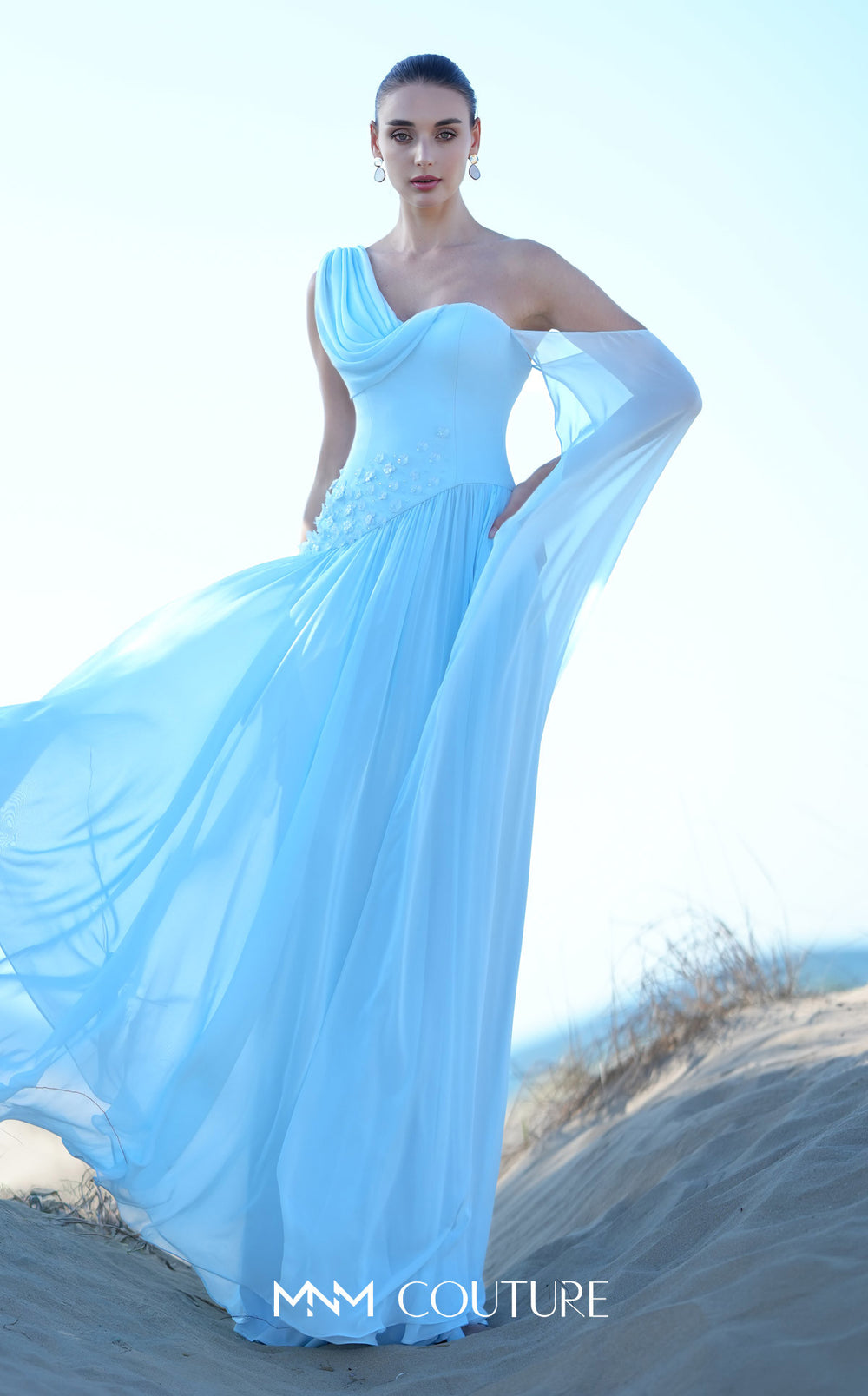 MNM Couture O09003 one-shoulder draped cowl A-line gown with floral appliqué view with skirt in motion