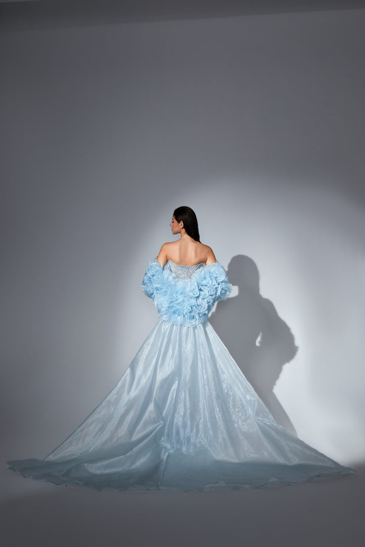 Delilah SH12052 Plunging Beaded Corset Mermaid Gown with Rosette Arm Puffs and Overskirt - Blue back view