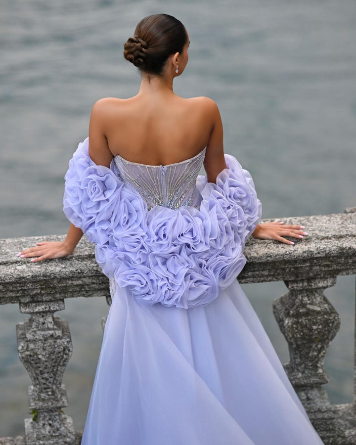 Delilah SH12052 Plunging Beaded Corset Mermaid Gown with Rosette Arm Puffs and Overskirt - Lavender back view