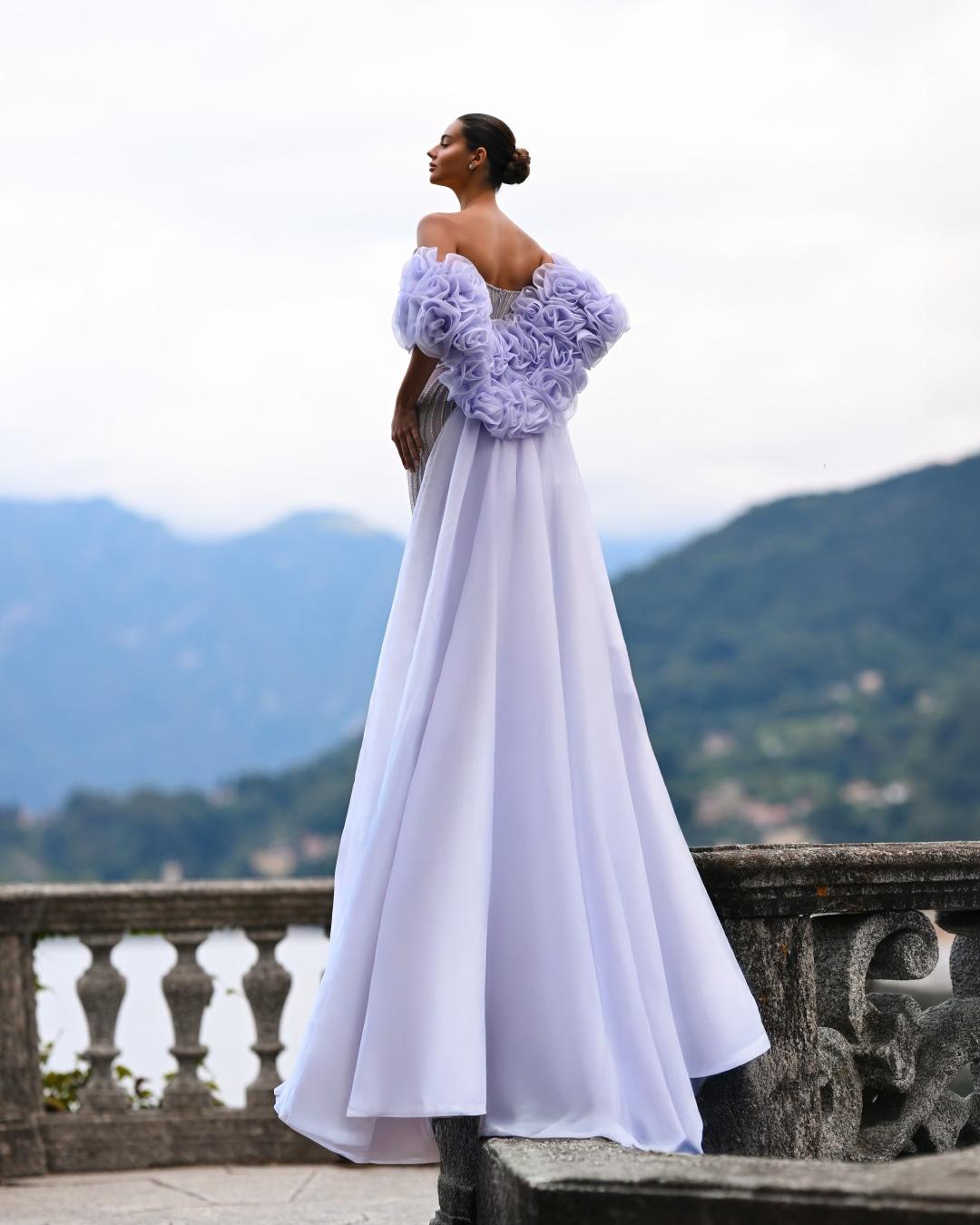 Delilah SH12052 Plunging Beaded Corset Mermaid Gown with Rosette Arm Puffs and Overskirt - Lavender back view